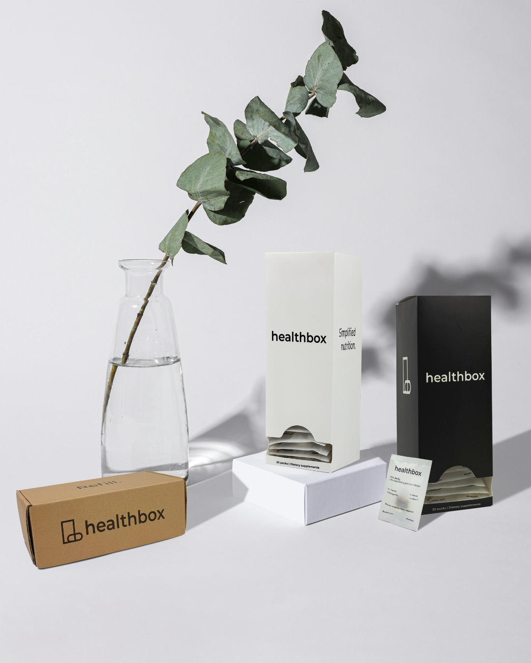 Healthbox products including a vase, box, and packaging on a white background