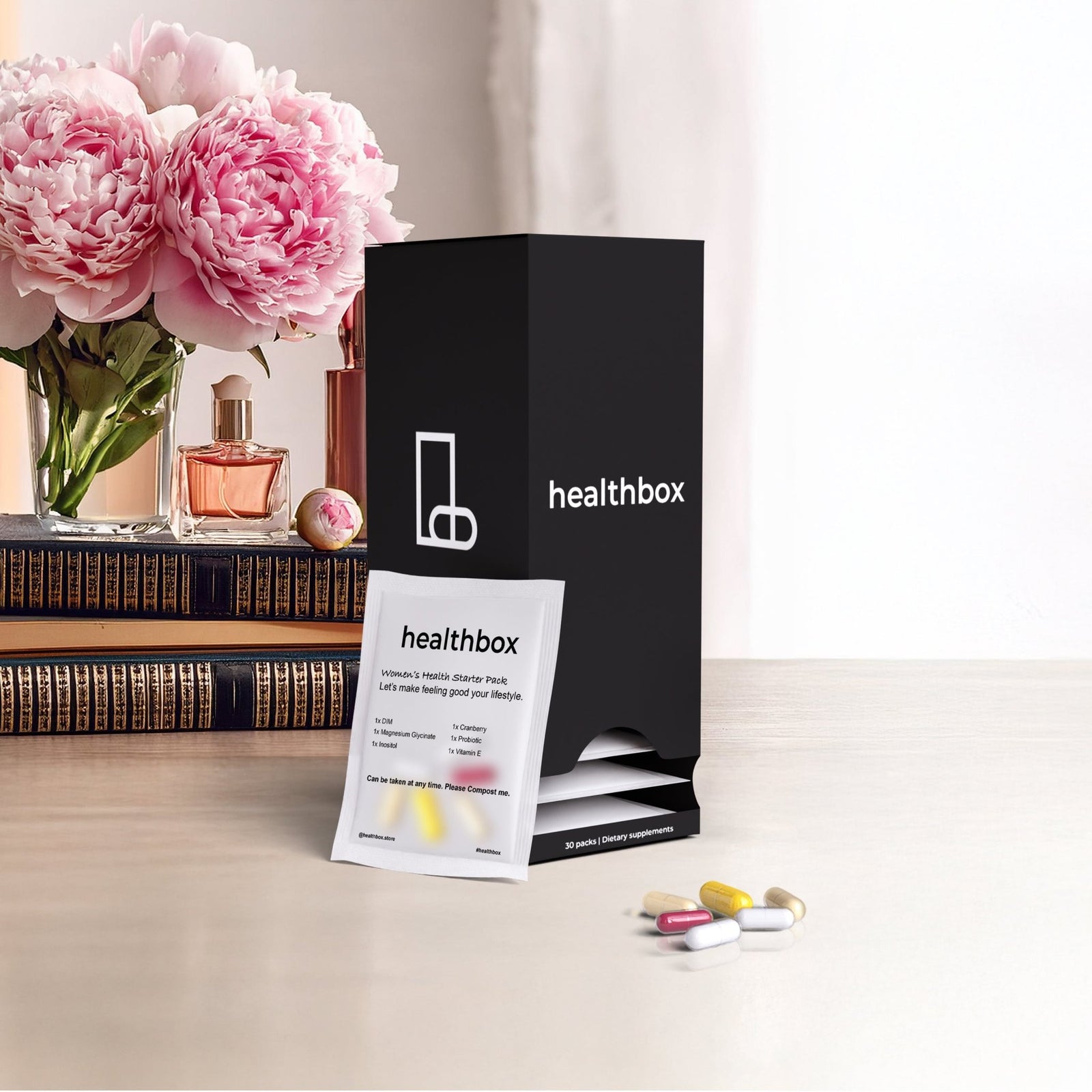 Woman’s Health Starter Pack daily sachets with personalized vitamins and supplements by Healthbox on a table